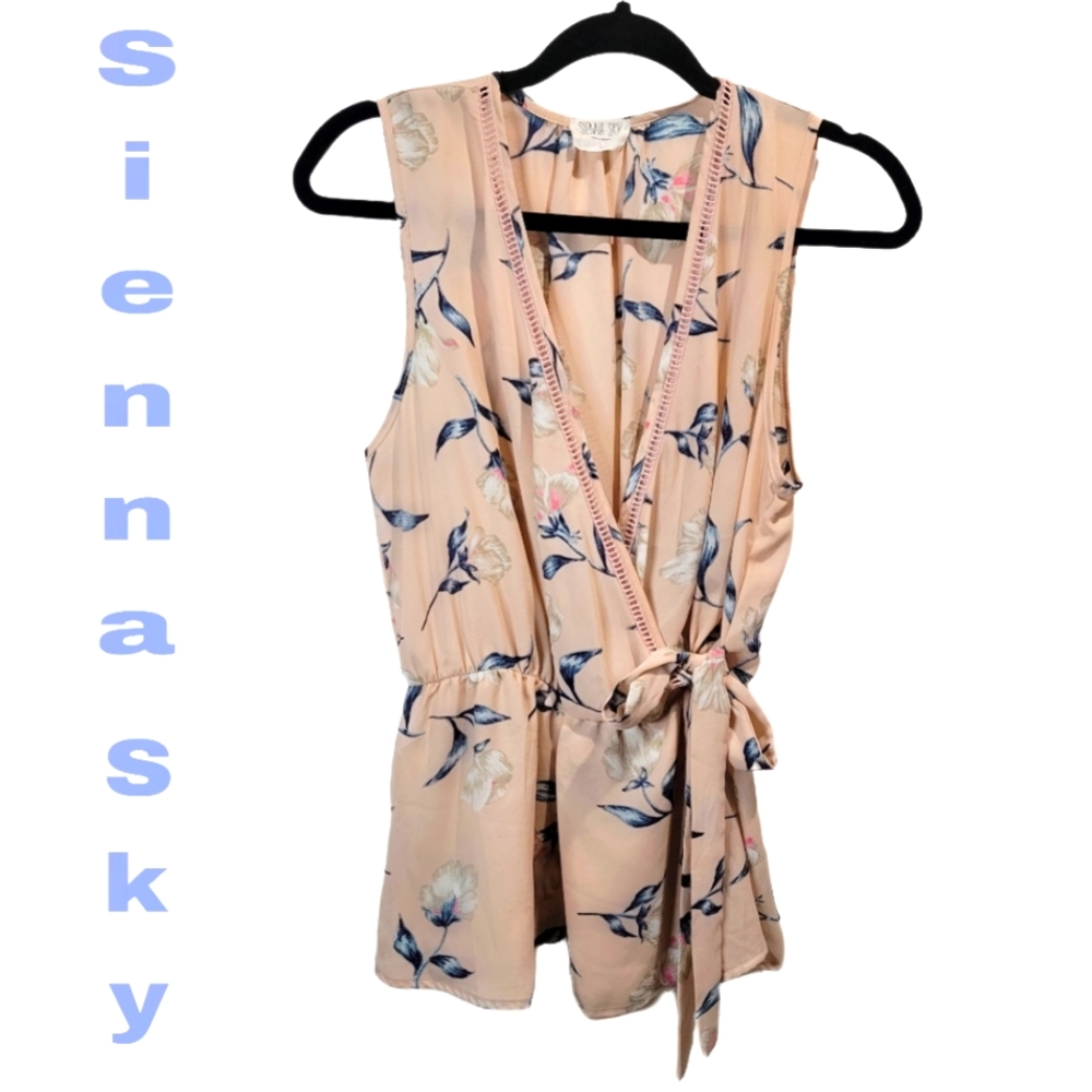 Sienna sky shirt, pink with blue and white flower designs, ties on side of waist